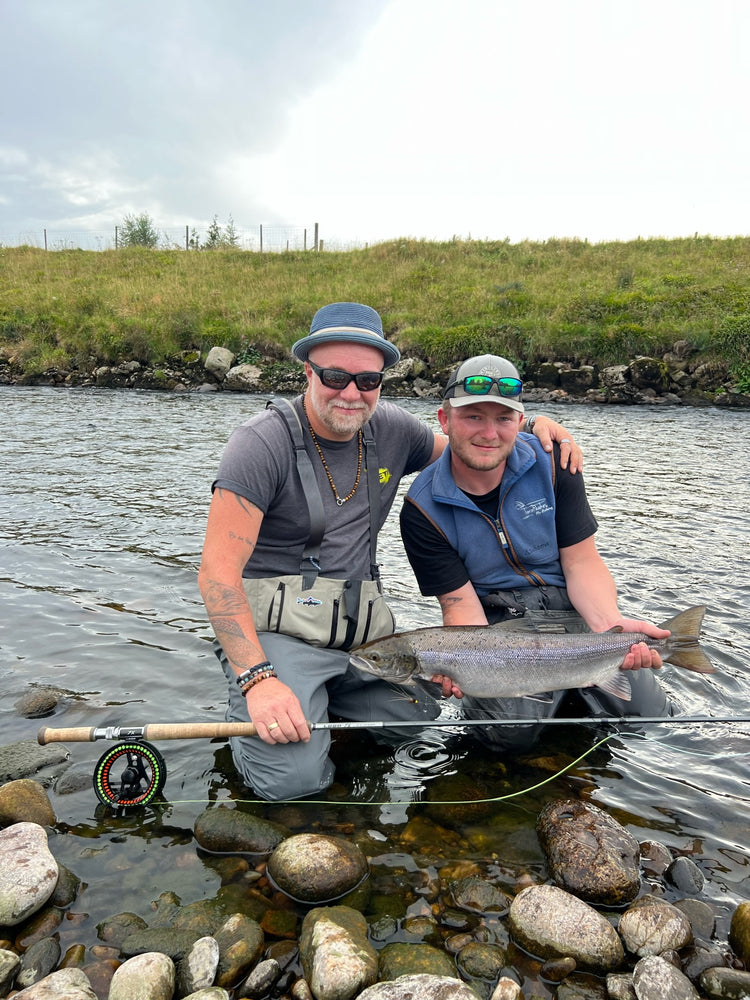 Anglers holding Atlanitc salmon caught on the river Dee at Crathes Castle beat near to Banchory with Twinpeakesflyfishing